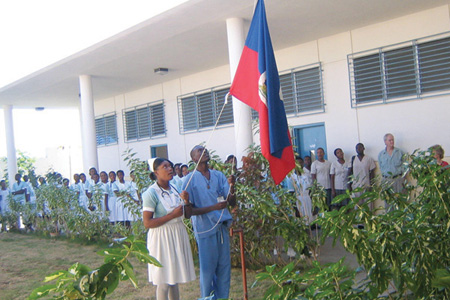 FSIL students raise the Haitian flag on the school’s campus. Photo: Courtesy of Haiti Nursing Foundation
