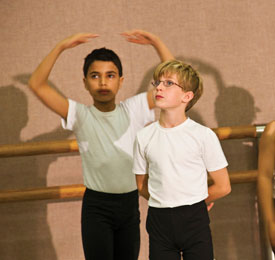 Noah Schwartz (left) and T.J. Langston watch intently in an April class. Eight months after first setting foot in the studio, they are preparing for their first performance. 